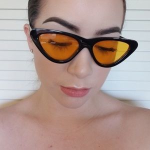 Black sunglasses with orange tint